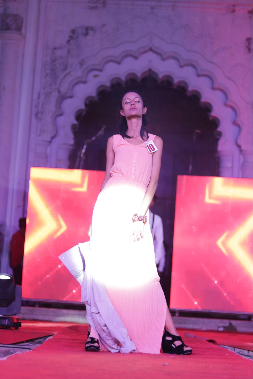 Close-up portrait of fashion model on event stage